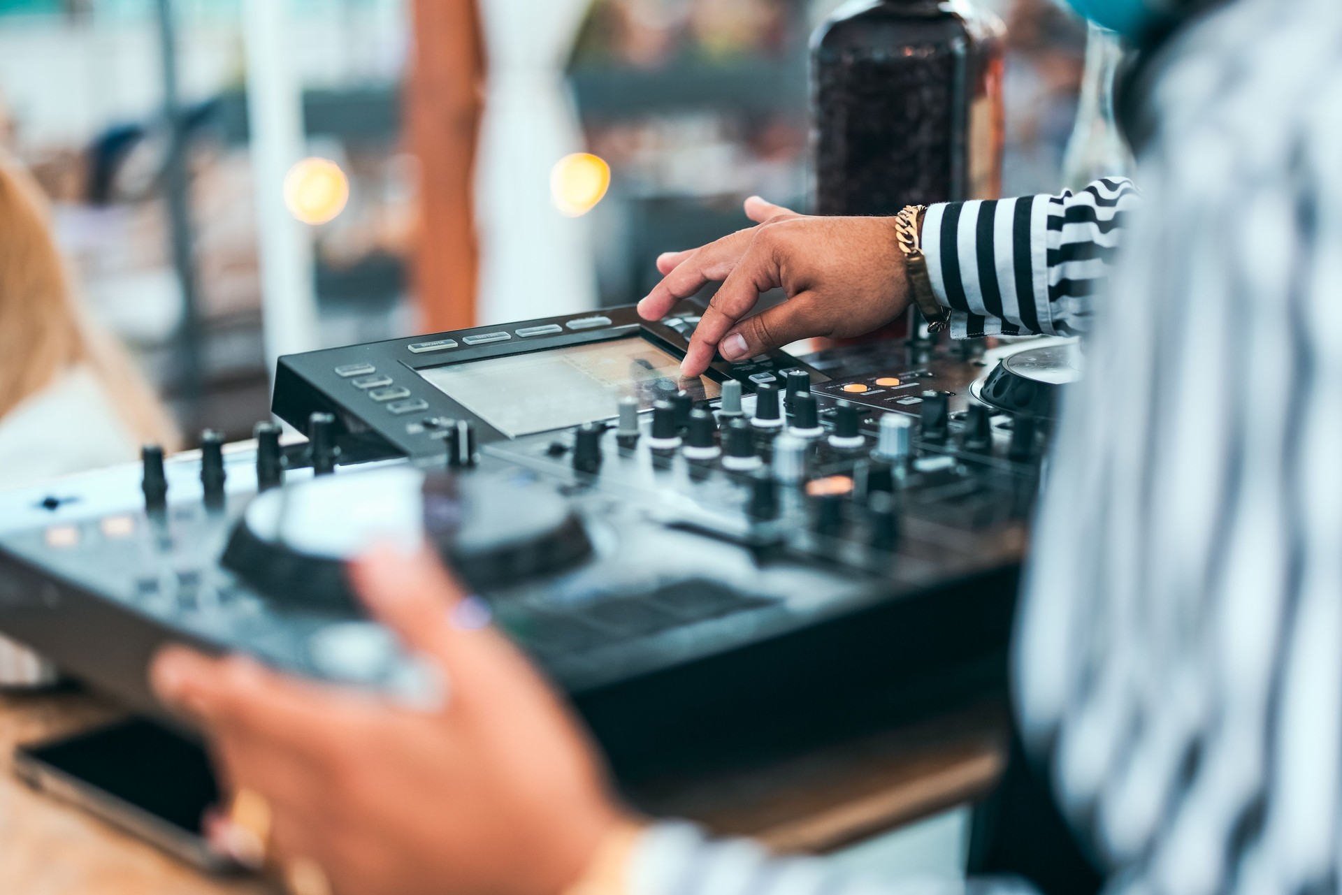 Close up dj hand mixing music at cocktail bar - Party nightlife concept